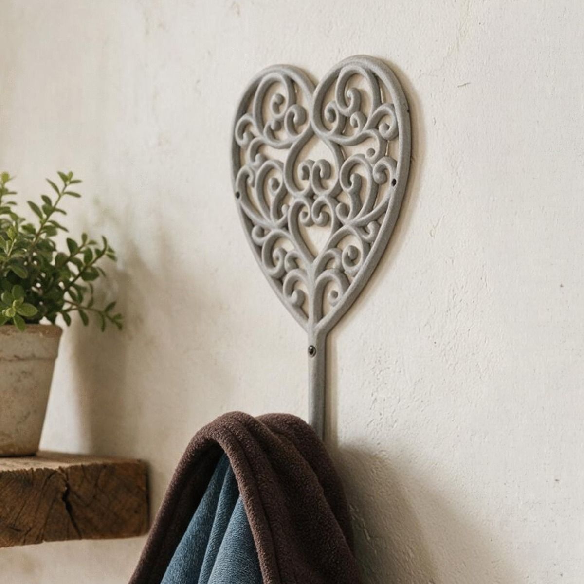 A Close up of a “Heartford” Scroll Heart Design Hook Mounted on a Wall in a Country Home - Digital Illustration 