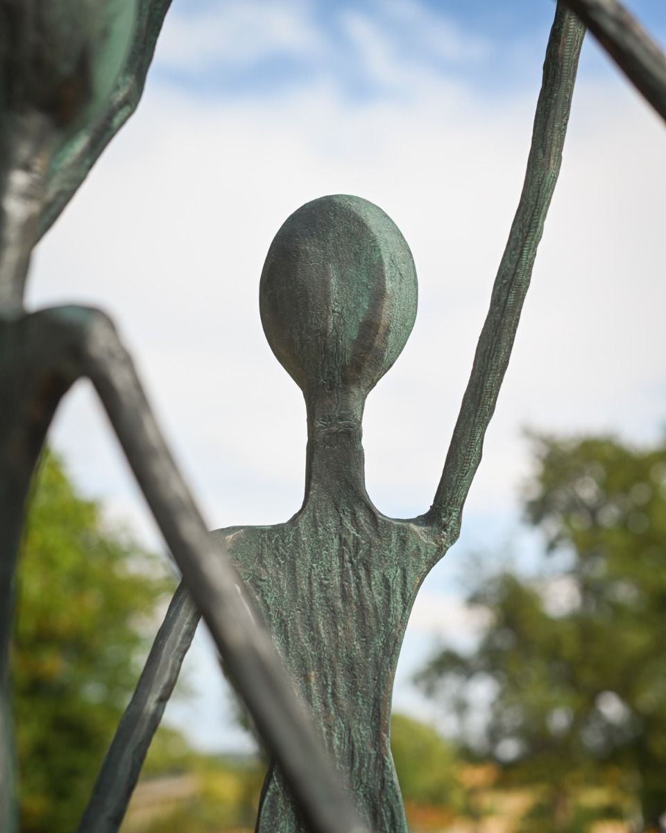 A Close up of one of the Figures from the "Lift" Cast Aluminium Garden Sculpture