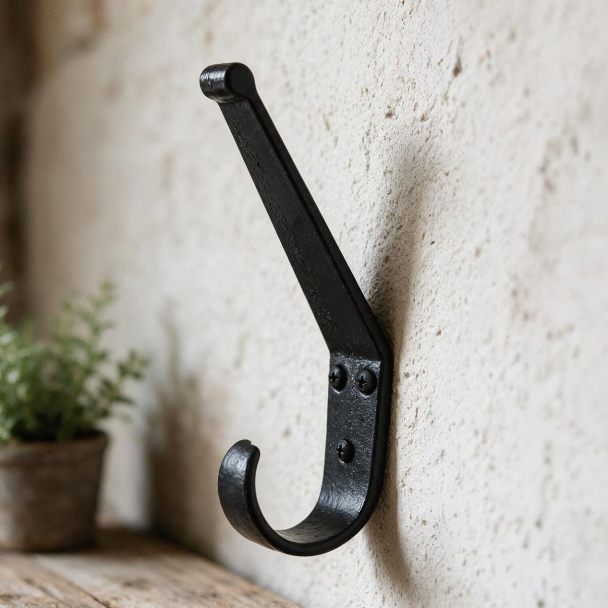 A Close up of the "Belsall Court" Blacksmith Iron Coat Hook Fitted to A Wall in a Traditional Home - Digital Illustration