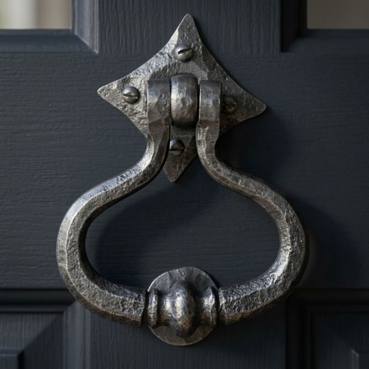 A Close up of the "Capulet" Pewter Shakespeare Door Knocker on a Blue Front Door With Windows - Digital Illustration 