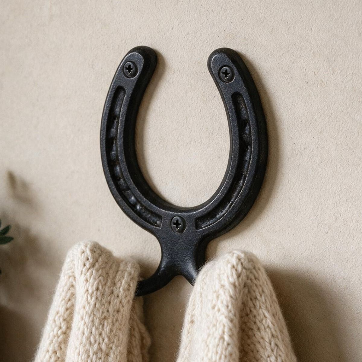 A Close up of the 75mm Iron Horse Shoe Hook Used to Hang up some Cardigans - Digital Illustration