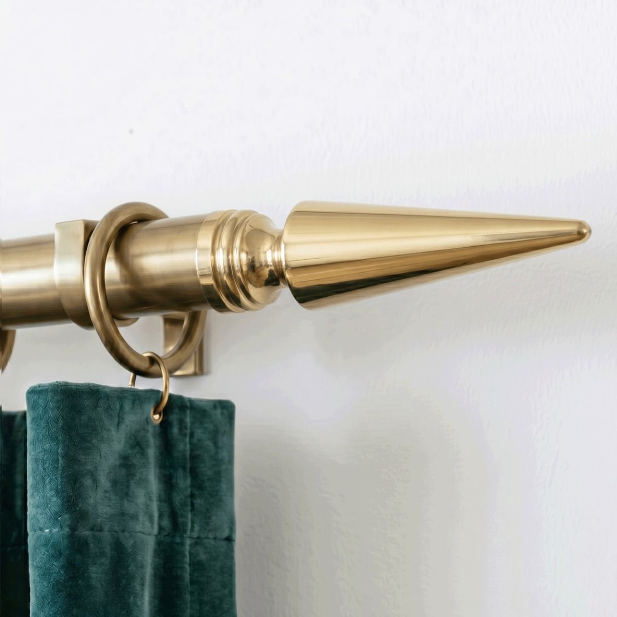 A Cone Curtain Finial Attached to a Matching Curtain Pole on a White Interior Wall Shown Close up - Digital Illustration.jpg A Cone Curtain Finial Attached to a Matching Curtain Pole on a White Interior Wall - Digital Illustration