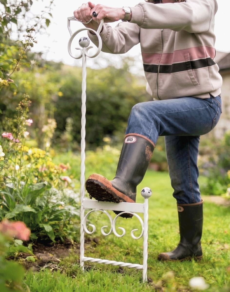 A Cream Boot Scraper Shown Being Used on a Lush Green Garden Lawn - Digital Illustration