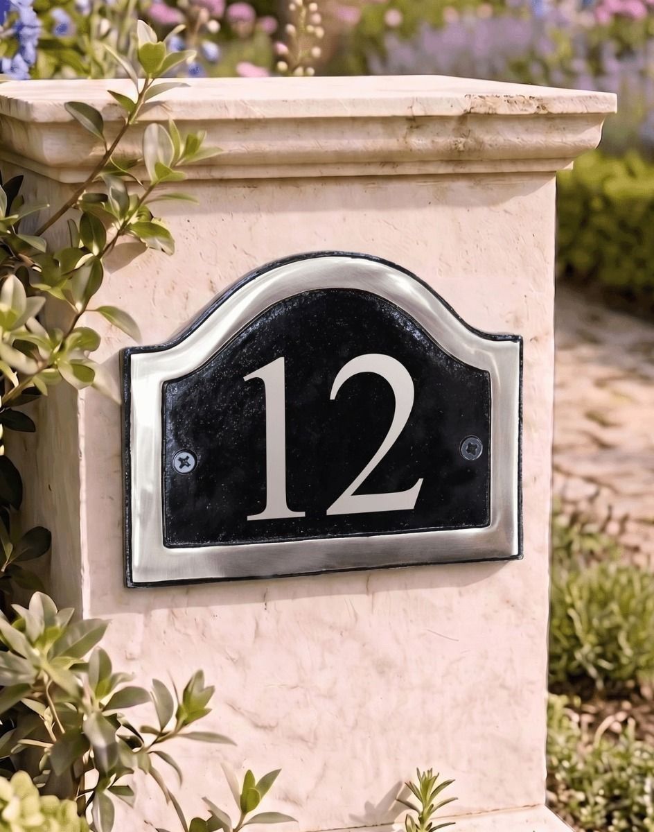 A Number 12 in Vinyl Black & Chrome Arched House Number Sign Mounted on a Garden pillar Driveway - Digital Illustration