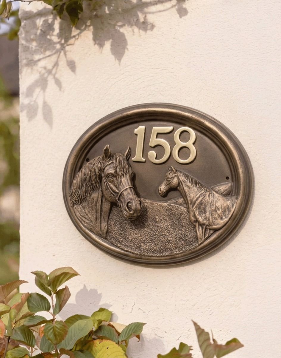 A Number 158 "Sanshire Stallion" Horse Number Sign in a Bronze Finish Mounted on a Sunny White Garden Wall - Digital Illustration 