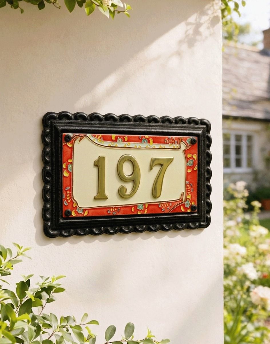 A Number 197 "Scarlett Garden" Large Black Iron & Ceramic House Sign Mounted on a White Coloured Cottage Wall - Digital Illustration