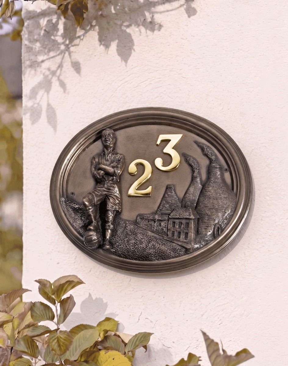 A Number 23 "Wembley Stadium" Footballer House Number Sign in a Bronze Finish Mounted on a Cream Coloured Cottage Wall - Digital Illustration