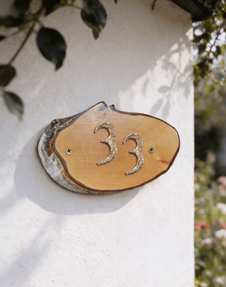A Number 33 Natural Hard Wood Rustic House Number Sign Mounted on a Sunny White Cottage Wall - Digital Illustration 