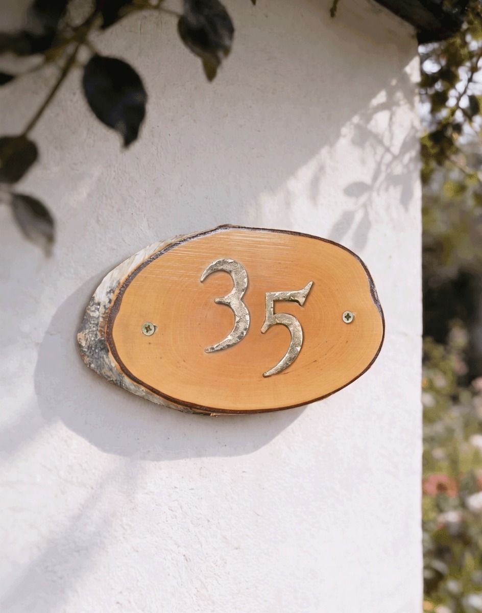 A Number 34 Natural Hard Wood Rustic House Number Sign Mounted on a Cream Coloured Cottage Wall - Digital Illustration