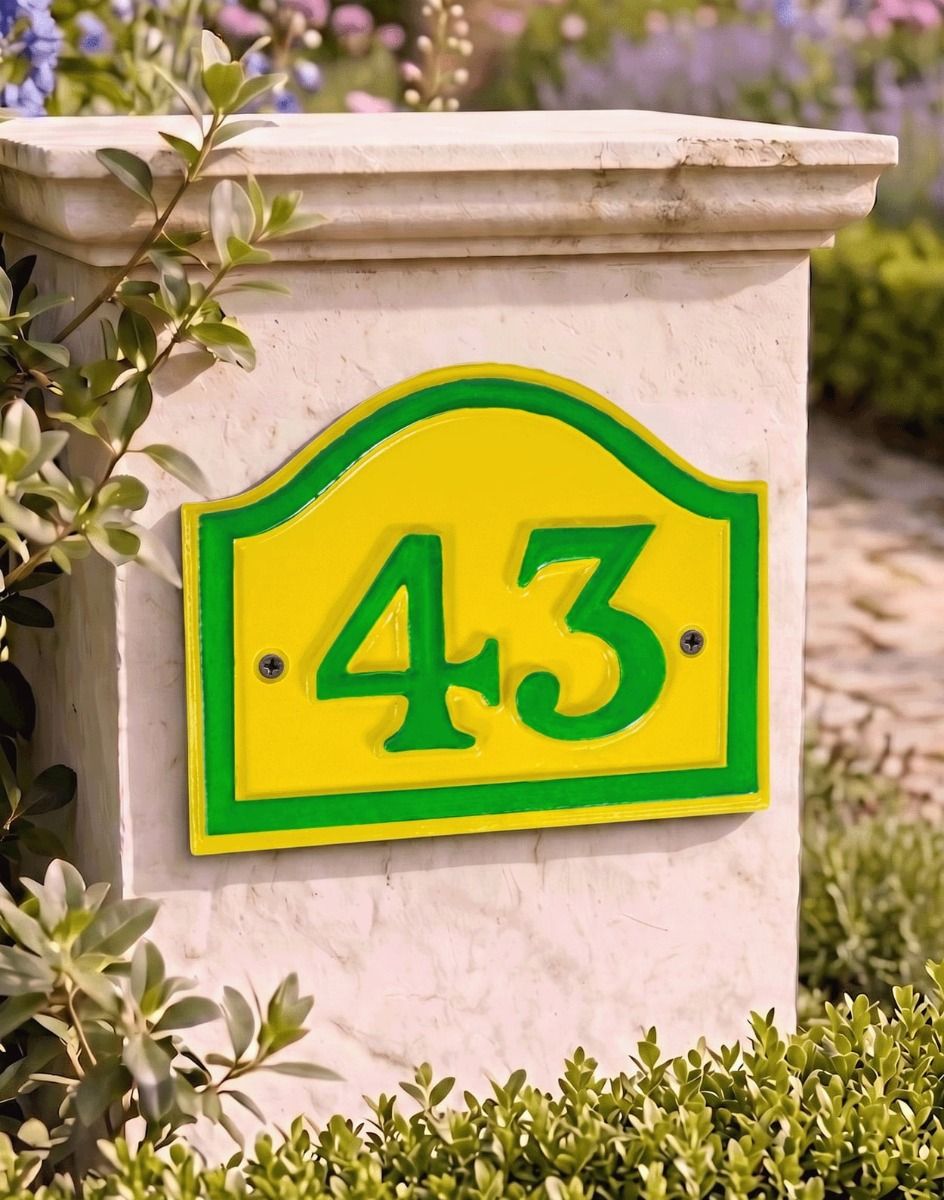 A Number 43 Yellow and Green Painted Arched House Number Sign Mounted on an Entrance Driveway Wall - Digital Illustration 