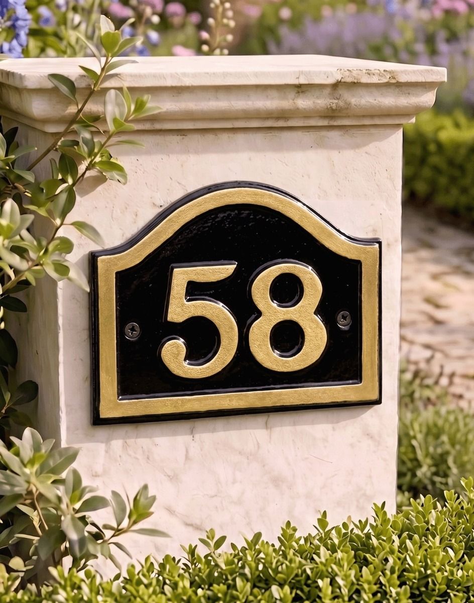 A Number 58 Black & Gold Painted Arched House Number Sign Mounted on a Wall next to an Entrance Driveway - Digital Illustration