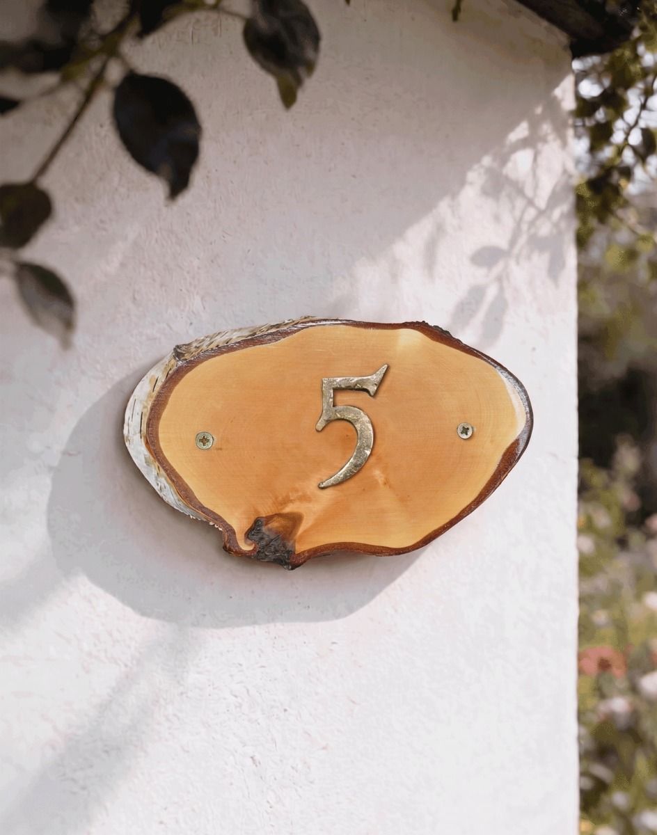 A Number 5 Natural Hard Wood Rustic House Number Sign Mounted on a Sunny Garden Cottage Wall - Digital Illustration