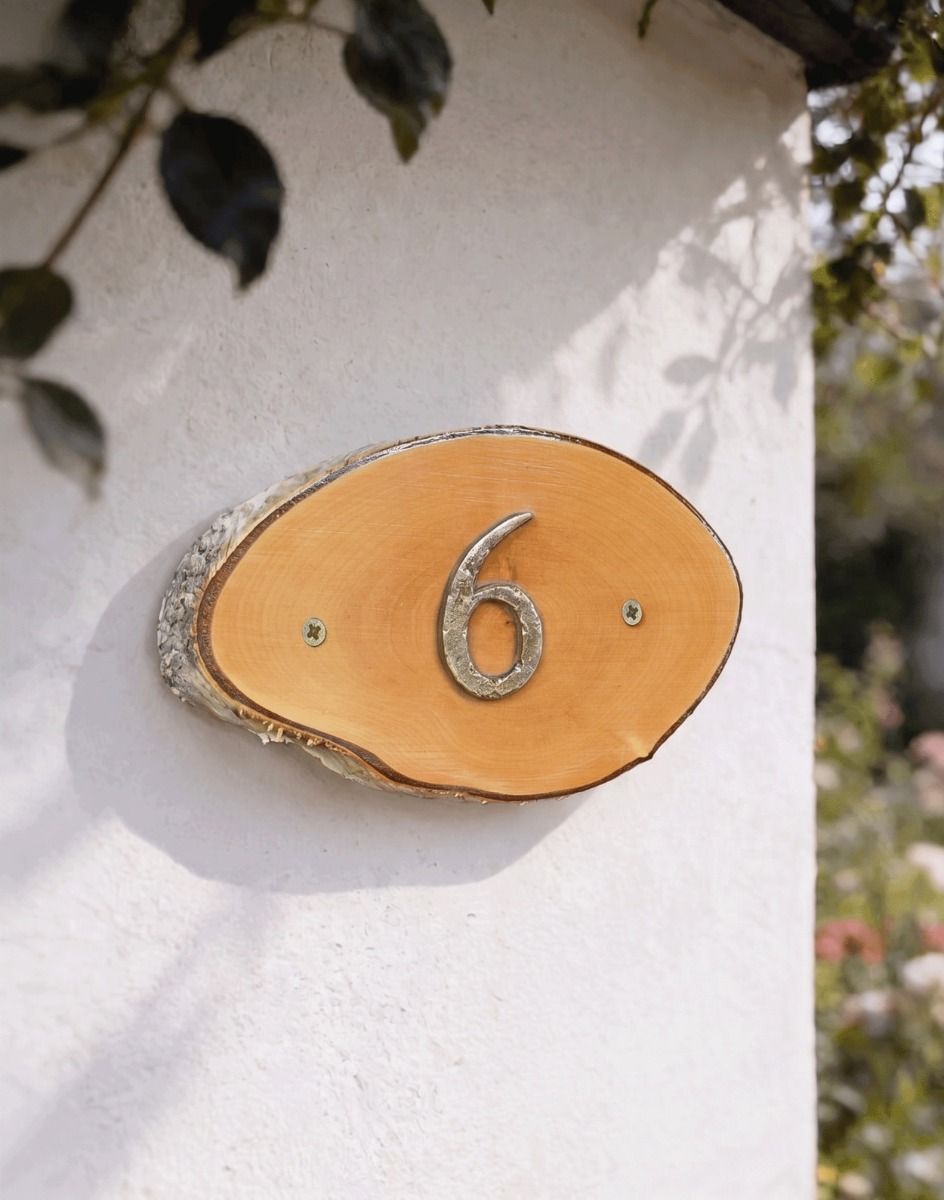 A Number 6 Natural Hard Wood Rustic House Number Sign Mounted on a Cream Coloured Garden Wall - Digital Illustration