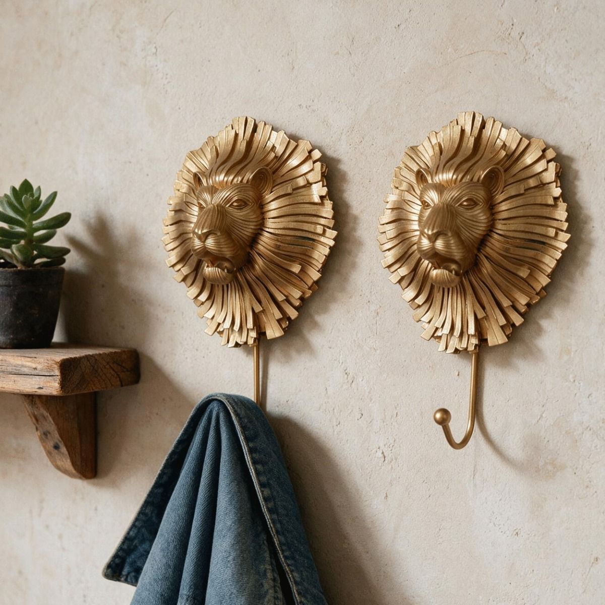 A Pair of Artistic Gold Lion Hooks Pictured on a Will Lit Interior Wall in a Modern Home - Digital Illustration 