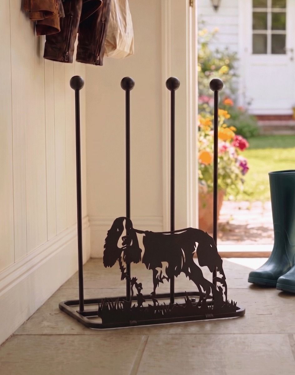 A Springer Spaniel Double Welly Rack Placed in `Front of an Open Doorway on a Stone Tile Floor - Digital Illustration 