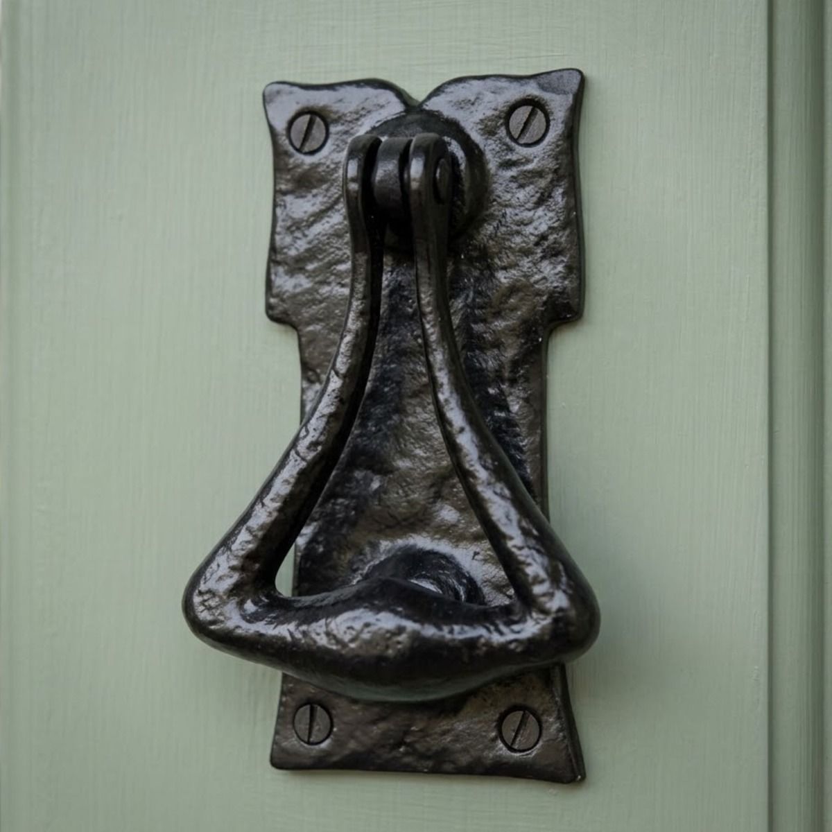 A Traditional Cast Iron Door Knocker on a Sage Green Front Door - Digital Illustration