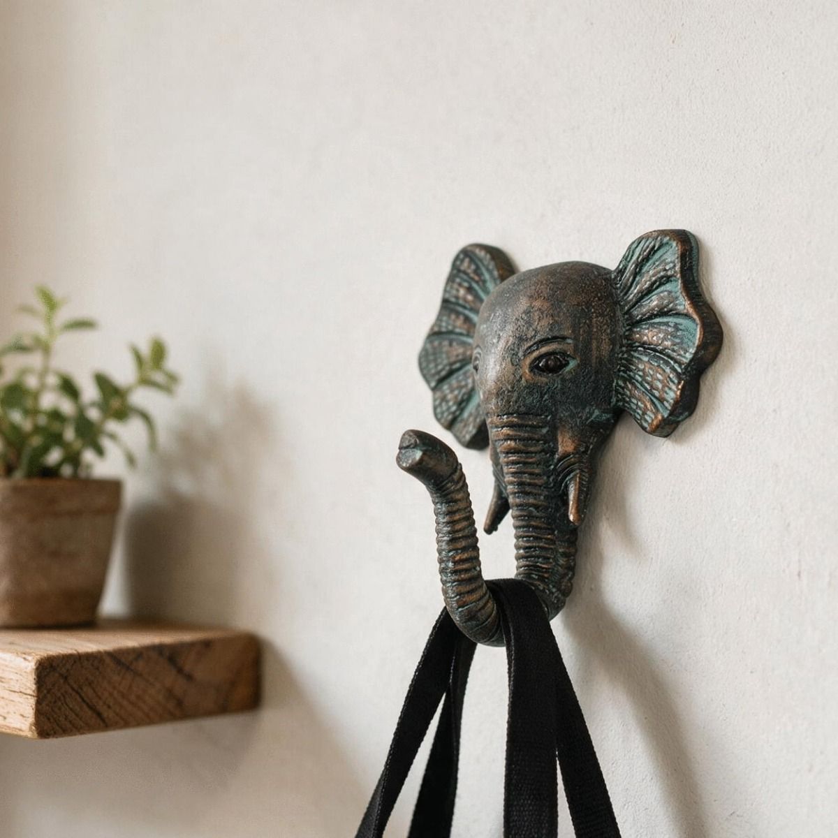A Verdigris Elephant Hook Shown on a Wall Used to Hold a Bag - Digital Illustration 