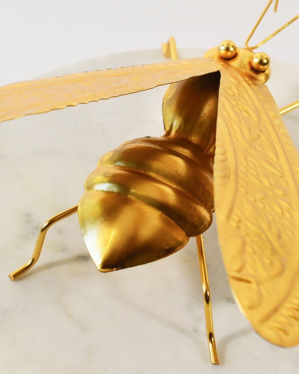 Close up of body and wings detail in recycled metal art sculpture Close up of body and wings detail in recycled metal art sculpture