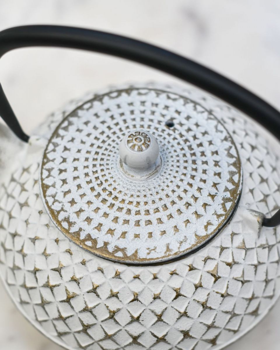 Close up of "Agawa" White Finish Cast Iron Japanese Style Teapot lid Close up of "Agawa" White Finish Cast Iron Japanese Style Teapot lid