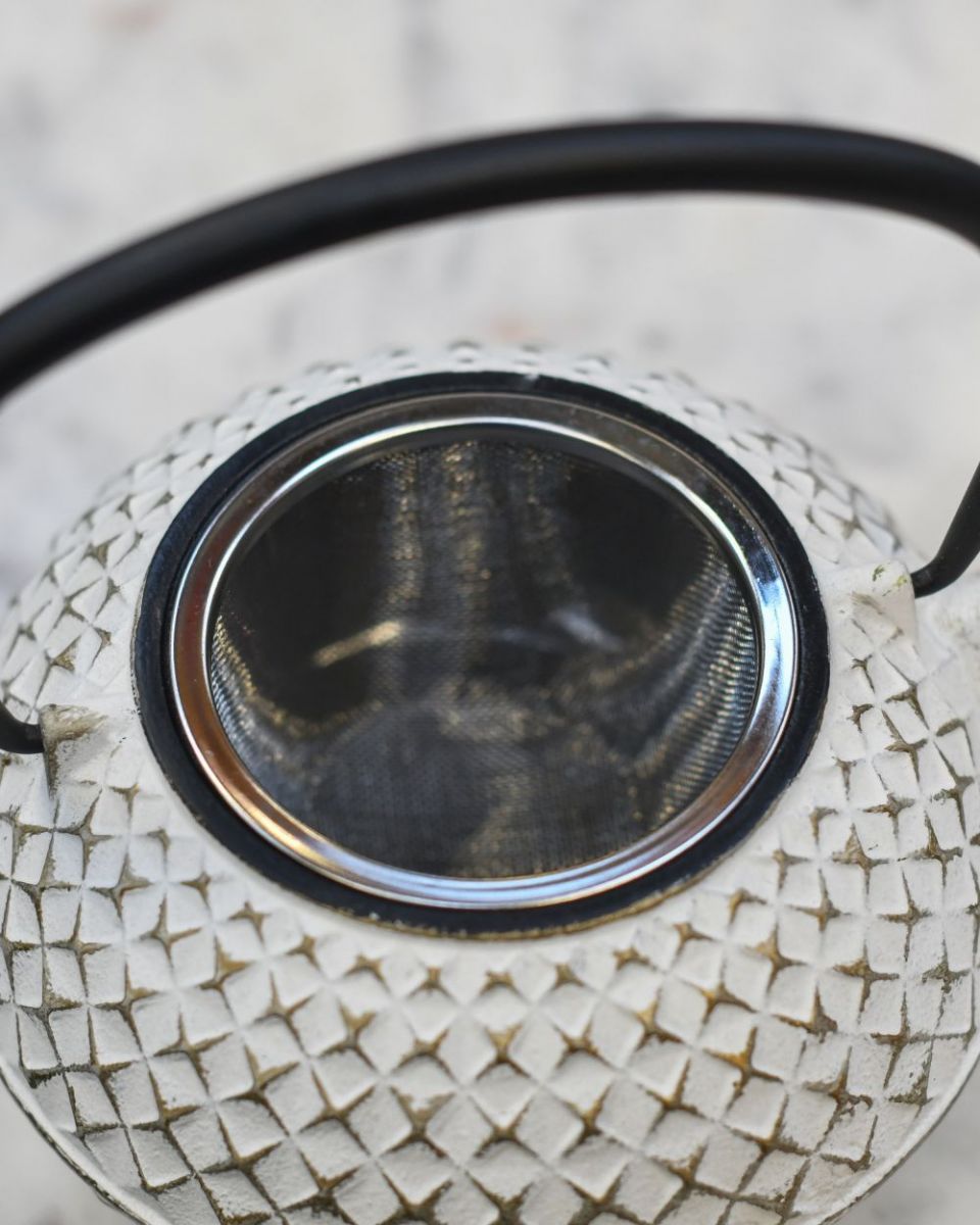 Close up of "Agawa" White Finish Cast Iron Japanese Style Teapot strainer Close up of "Agawa" White Finish Cast Iron Japanese Style Teapot strainer
