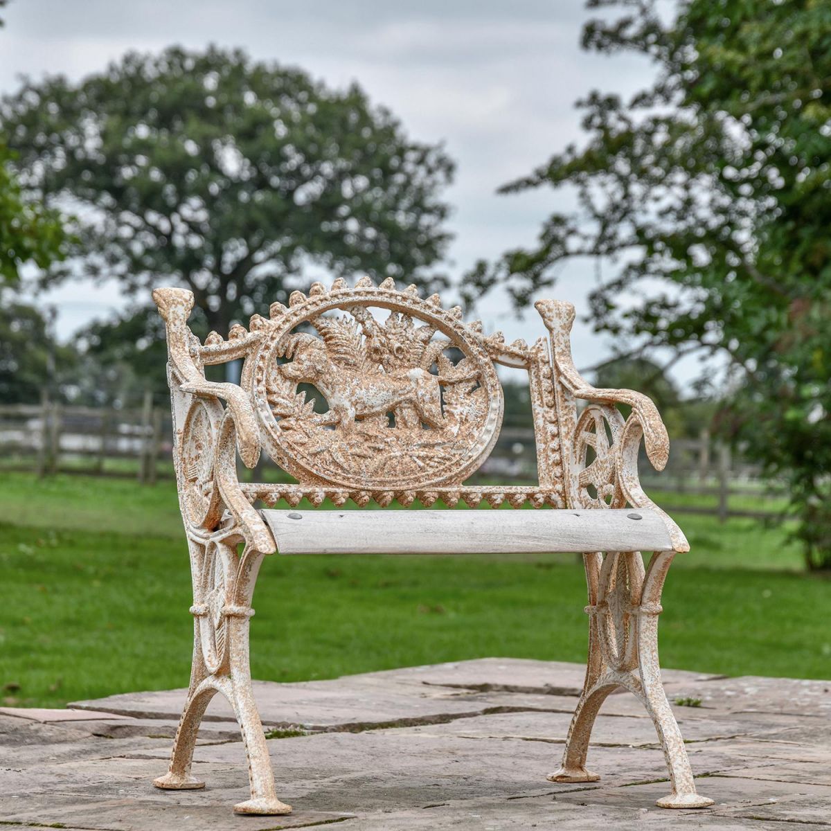 Aged Cream Cast Iron Dog One Seat Park Bench in situ