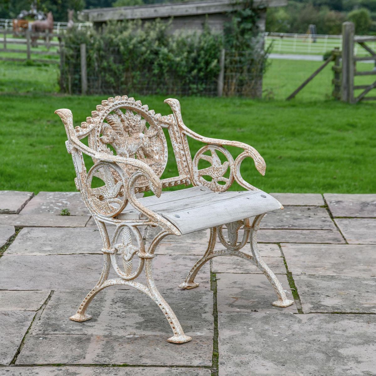 Aged Cream Cast Iron Dog One Seat Park Bench in Situ on the Patio