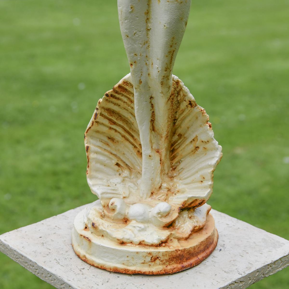 Close-up of the Base of the Lady Standing on Clam Sculpture