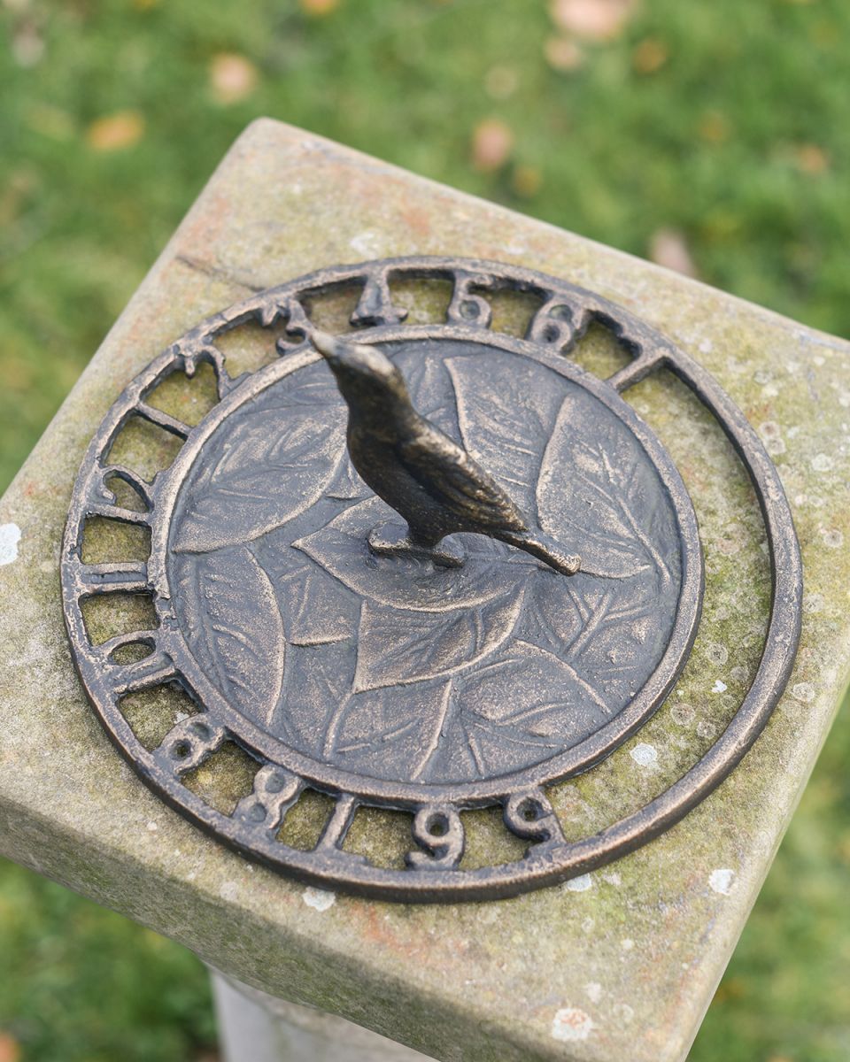 Aged Iron "Tweeting Time" Bird Sundial in Use outside in the Garden