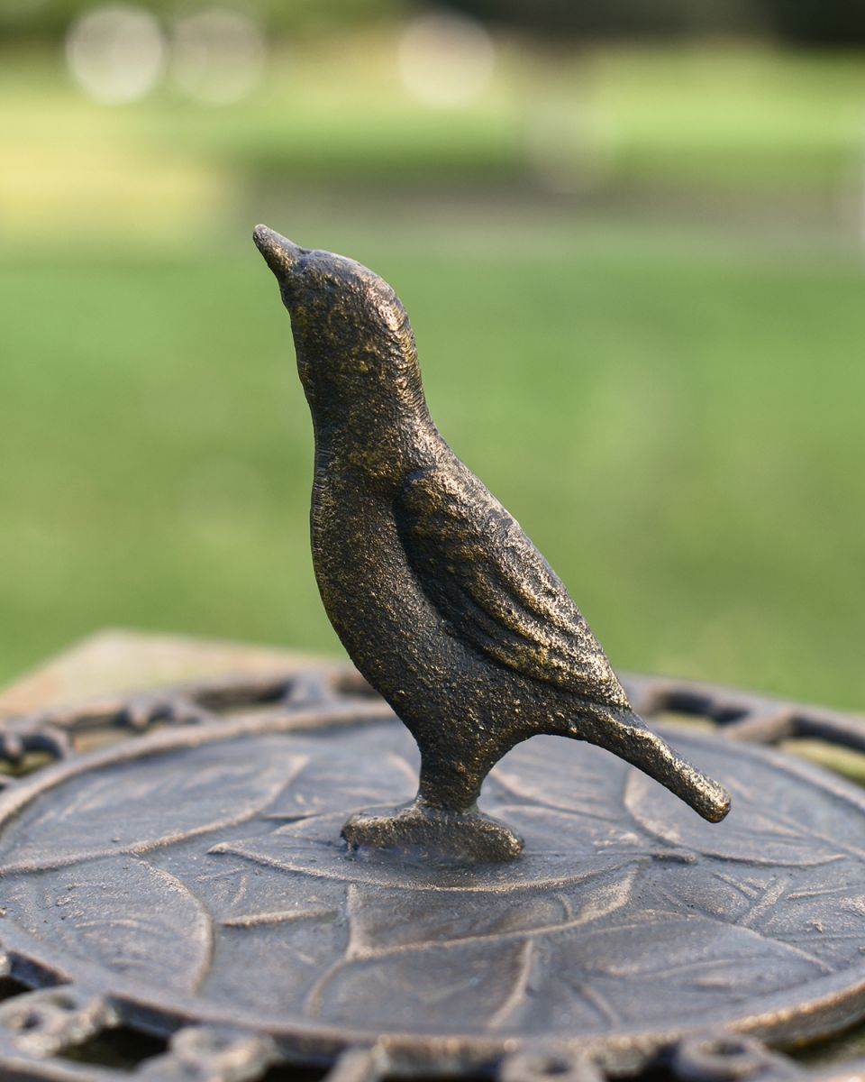 Close-up of the Aged Iron "Tweeting Time" Bird on the Sundial