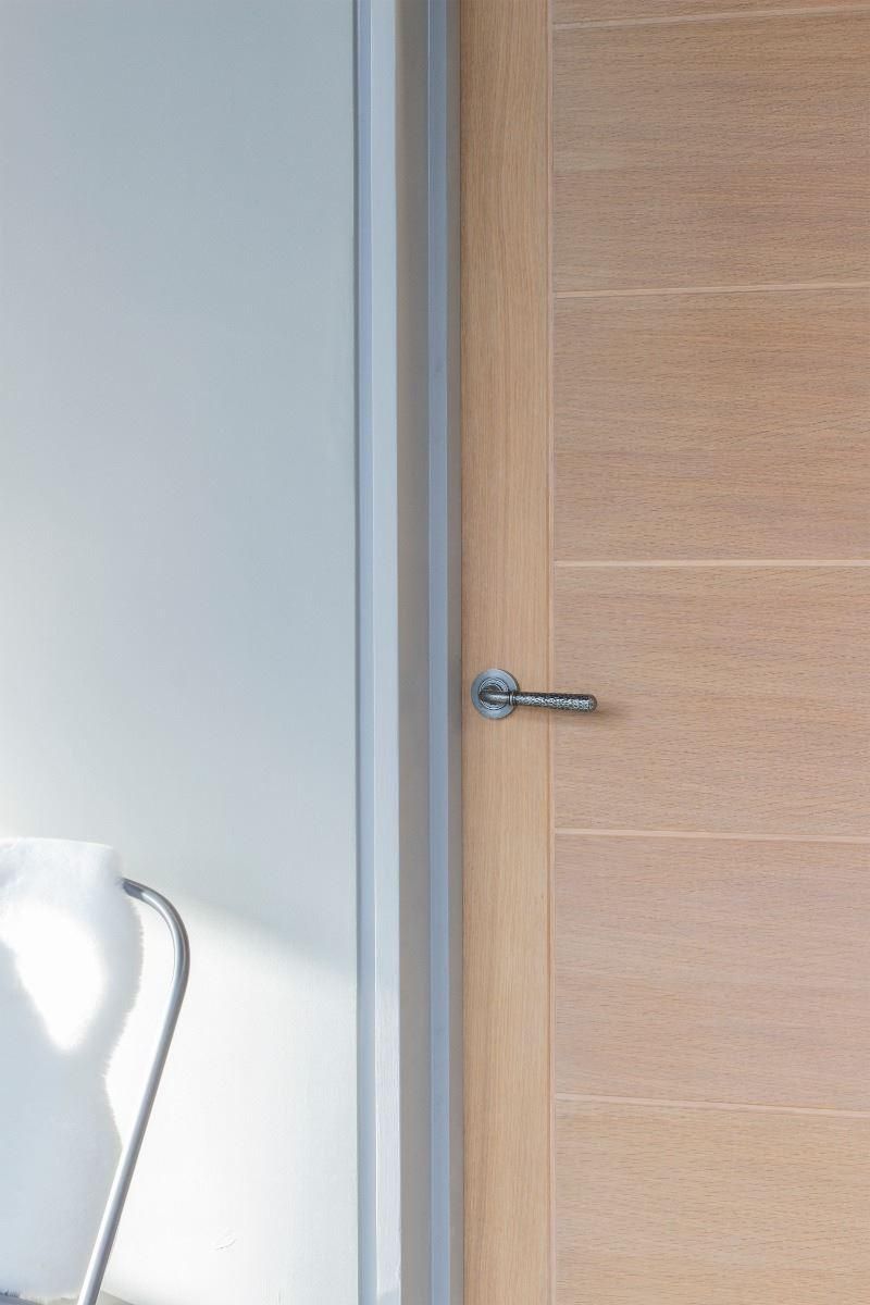 Aged Pewter Hammered Unsprung Lever Door Handle on Rose in Situ Aged Pewter Hammered Unsprung Lever Door Handle on Rose in Situ