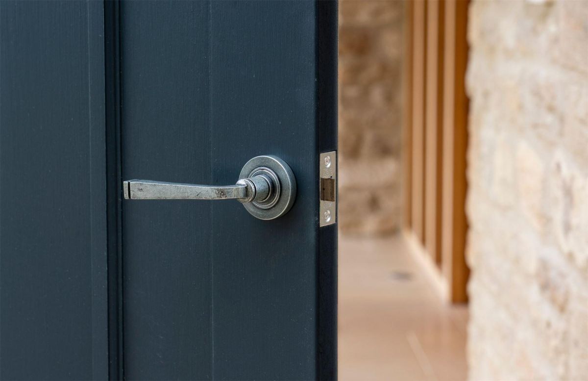 Aged Pewter Unsprung Lever Door Handle on Rose in Situ