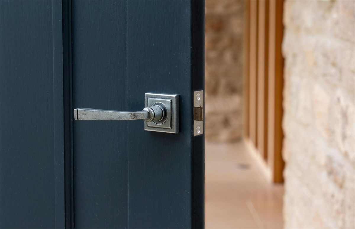Aged Pewter Unsprung Lever Door Handle on Square Rose in Situ Aged Pewter Unsprung Lever Door Handle on Square Rose in Situ