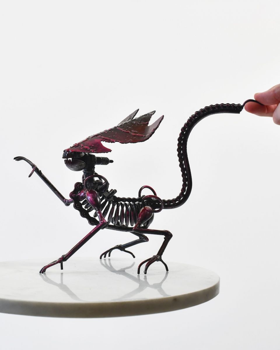 Scale image of alien recycled metal sculpture Scale image of alien recycled metal sculpture
