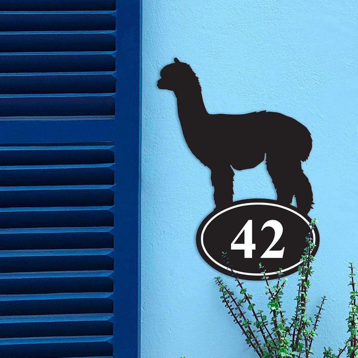 Alpaca Iron House Number Sign in Situ on a Blue Wall