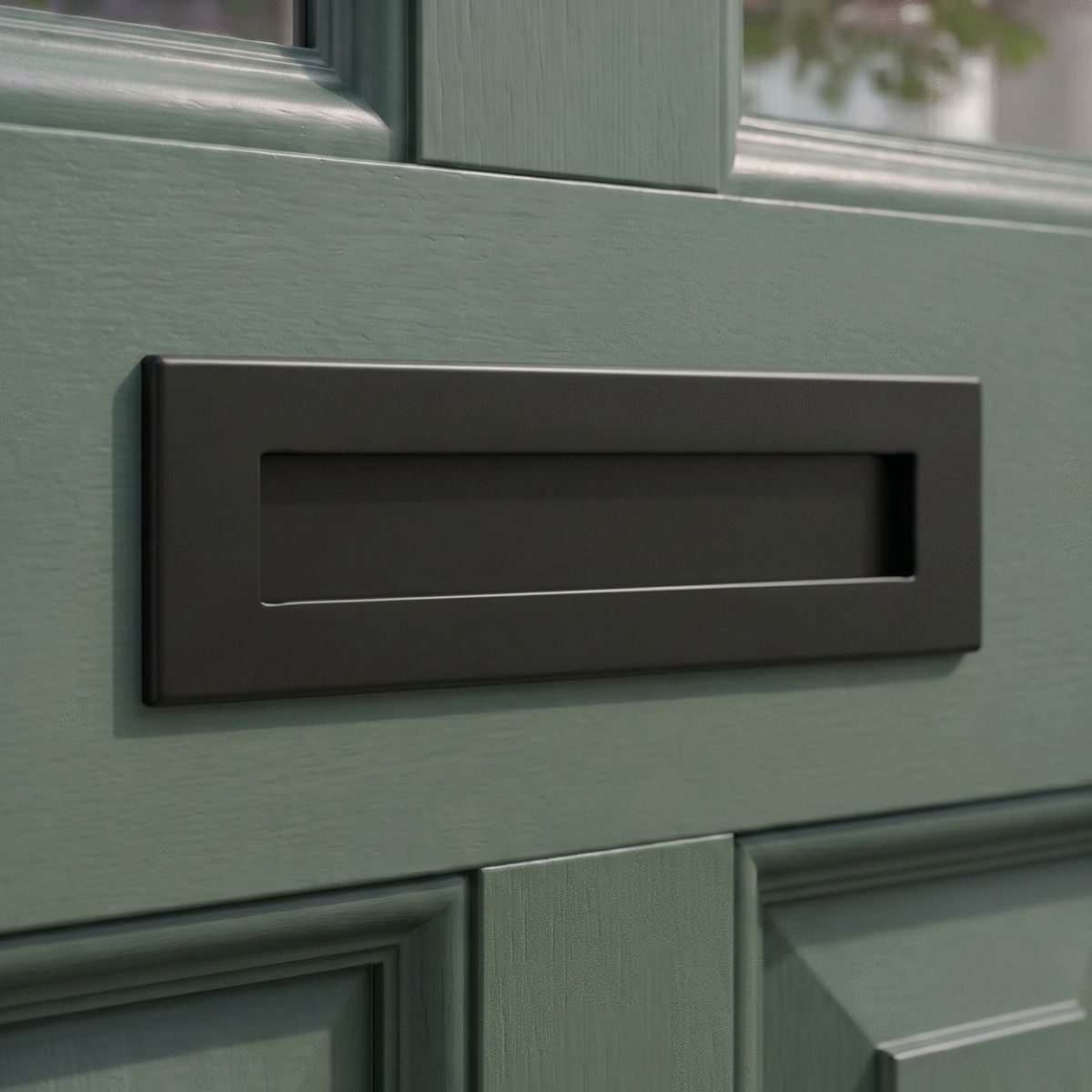 An Aged Bronze Traditional Sleeved Door Letterbox Set on a Dark Green House Front Door - Digital Illustration 