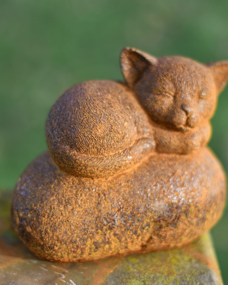 Angle of sleeping kitten cast iron garden sculpture Angle of sleeping kitten cast iron garden sculpture