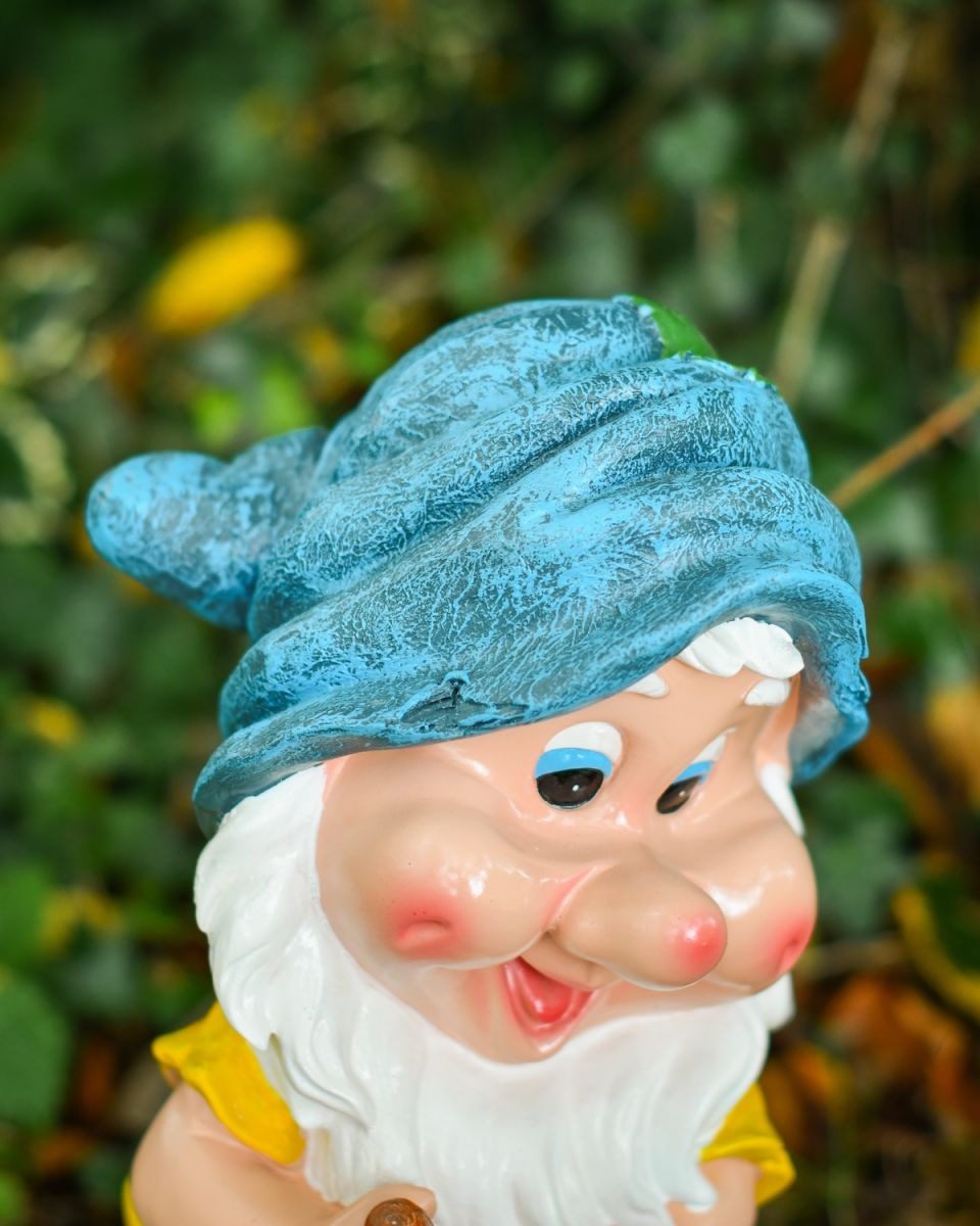 Close up of intricate hat detail on colourful garden gnome ornament