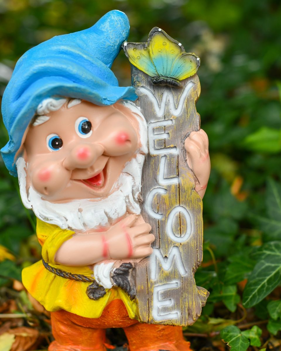 Close up of intricate detail on colourful outdoor gnome ornament