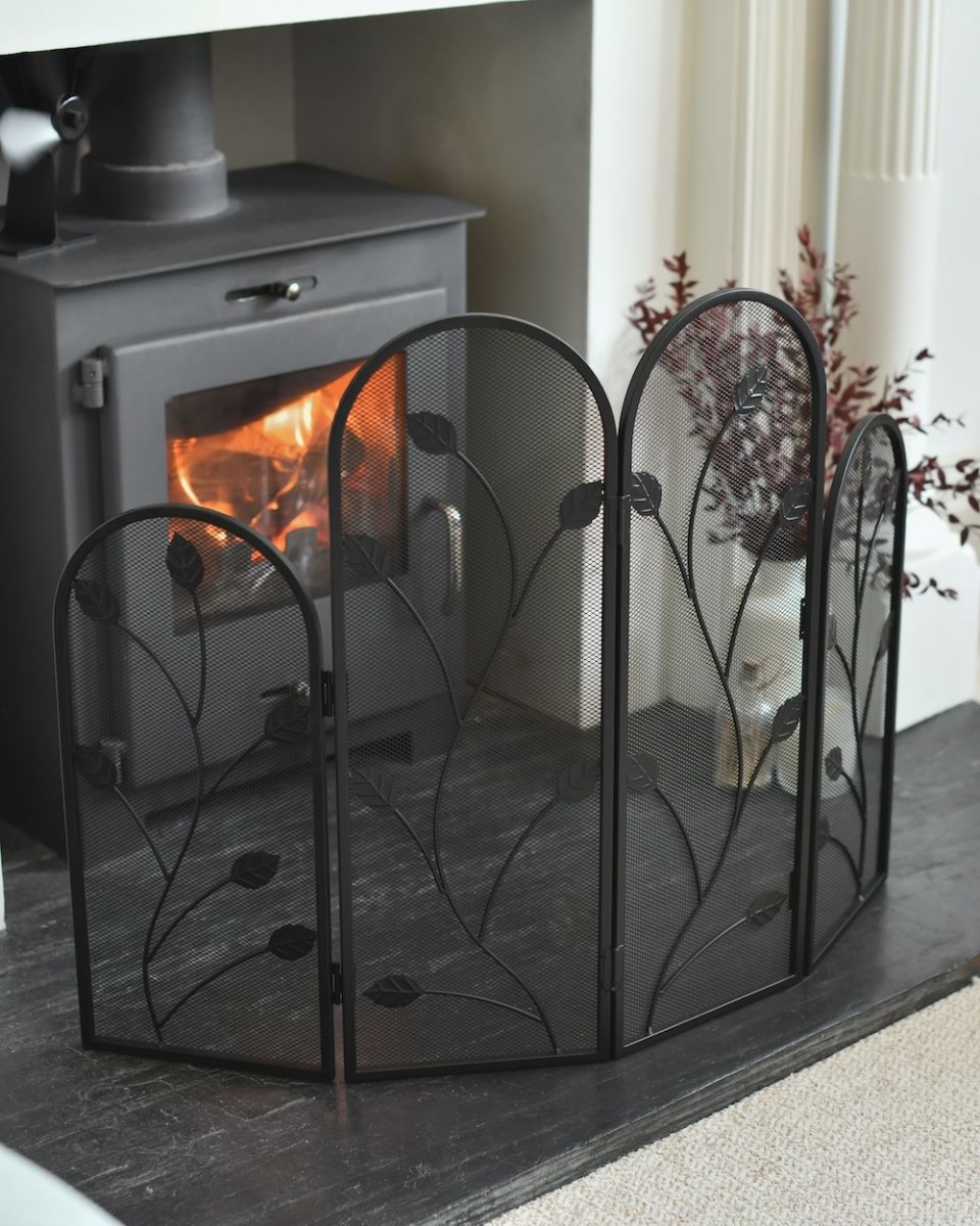 In situ photo of ornate vine detailing fire guard In situ photo of ornate vine detailing fire guard