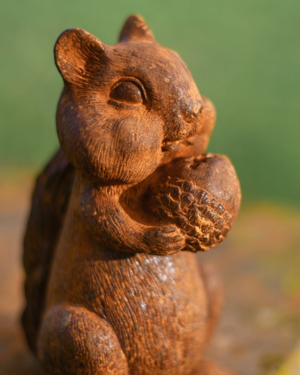 Close up of face detail on rustic finish patio sculpture Close up of face detail on rustic finish patio sculpture