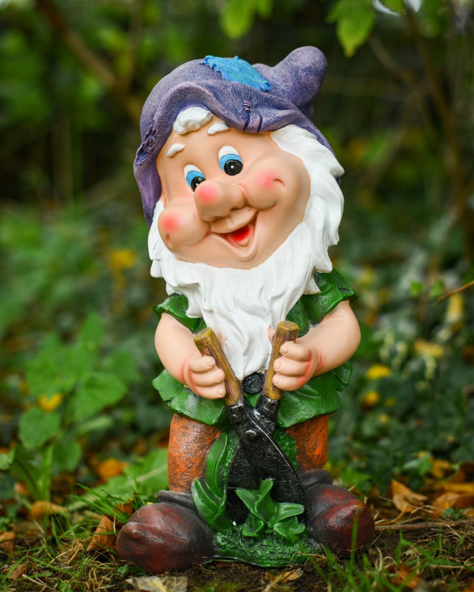 Angled view of colourful outdoor gnome sculpture