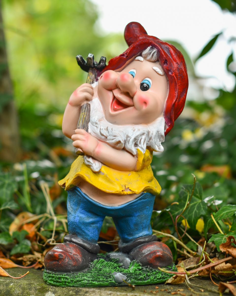 Angled view of colourful garden gnome sculpture