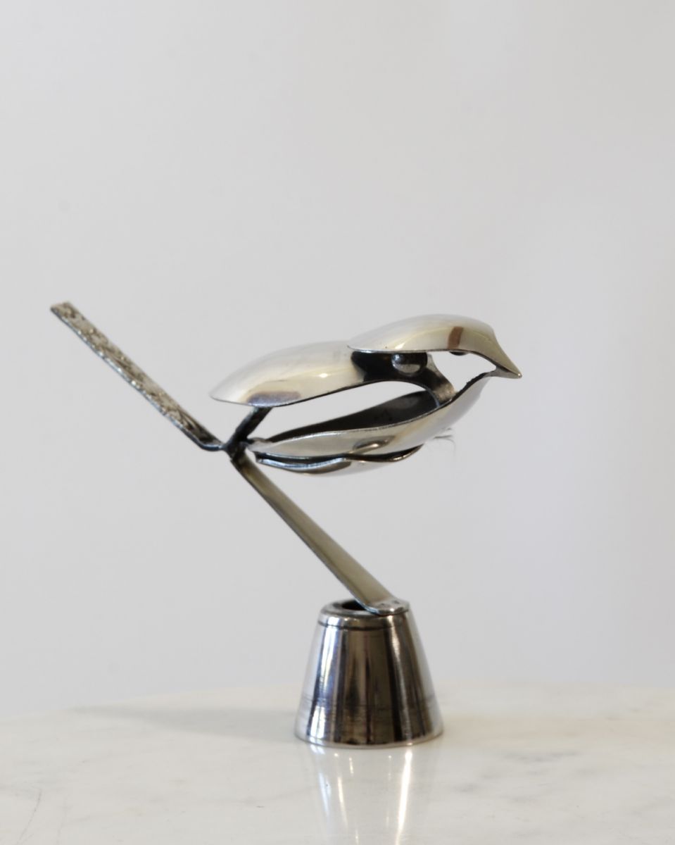 Angled view of scrap metal bird art sculpture