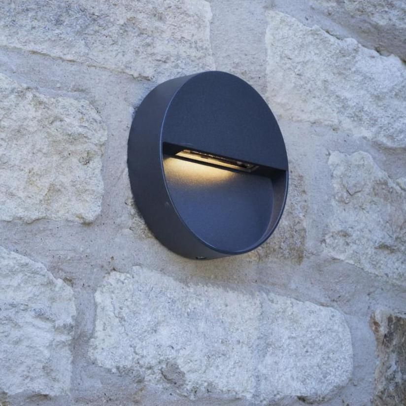 Round Eye-Lid Style Wall Light in Situ on a Stone Wall