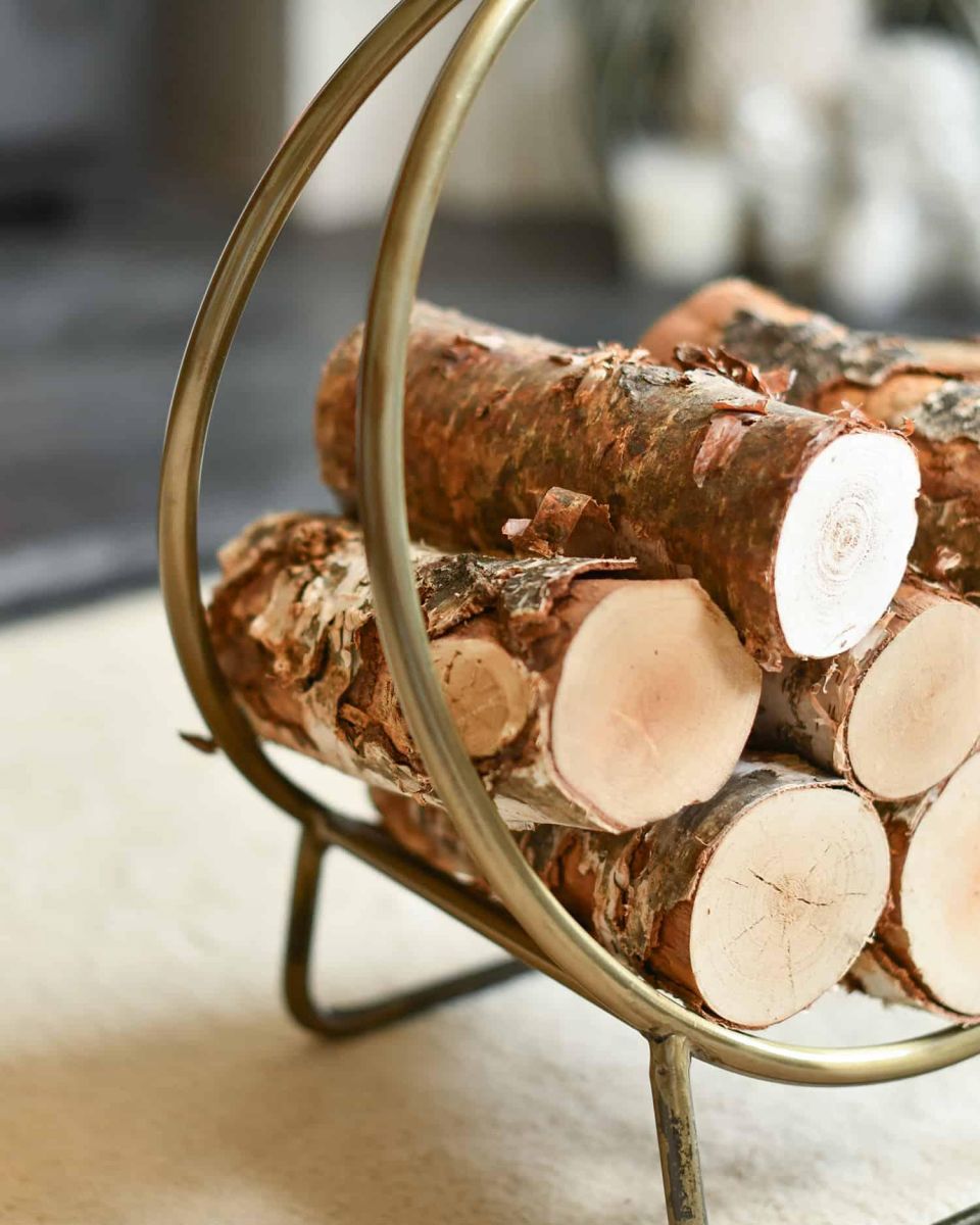 Close-Up of 45cm Antique Brass Contemporary Circular Log Rack & Holder With Handle in Situ