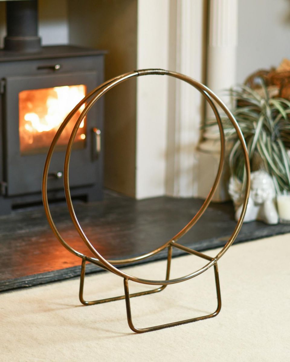 Antique Brass Contemporary Circular Log Rack & Holder With Handle In A Fireplace Setting Antique Brass Contemporary Circular Log Rack & Holder With Handle In A Fireplace Setting