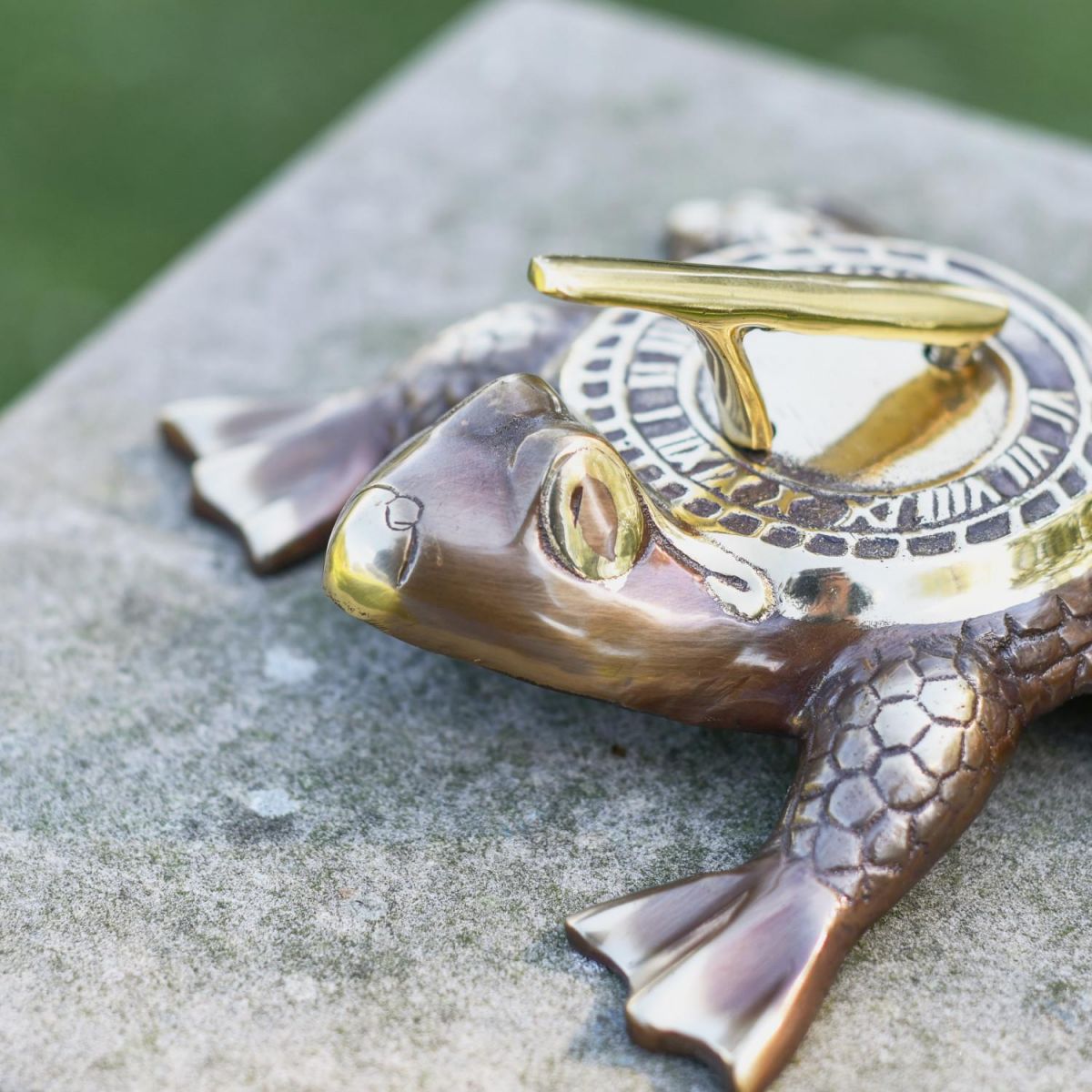 Close-Up of Antique Brass Finish on Frog Prince Sundial