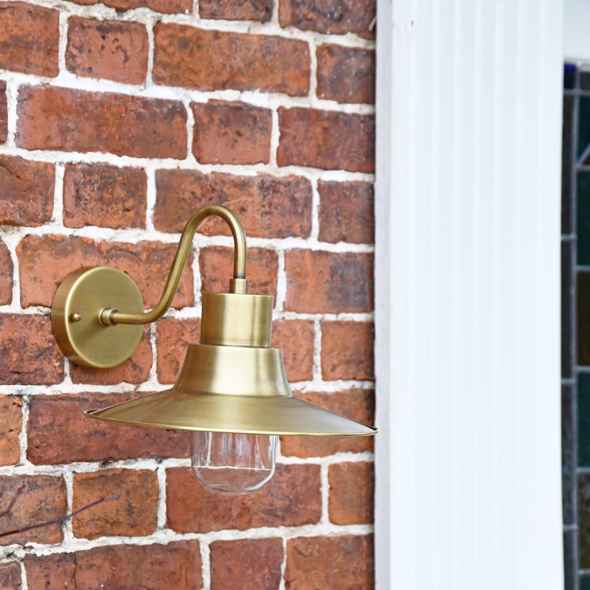 Antique Brass Traditional Barn Wall Light Next to the Front Door  Antique Brass Traditional Barn Wall Light Next to the Front Door