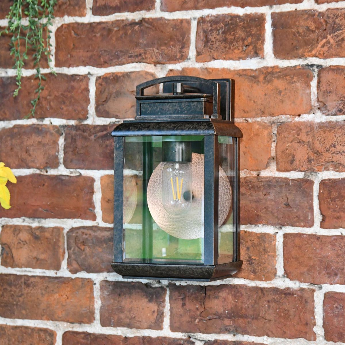 Antique Bronze Hanging Wall Light With Reflector Plate in Situ on a Brick Wall