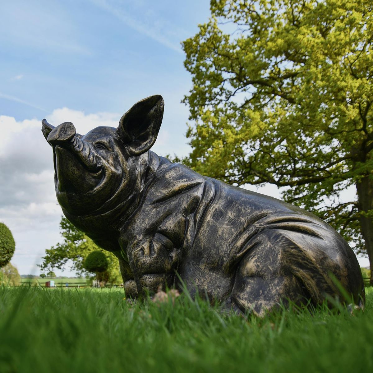 Side View of the Antique Bronze Sitting Pig Sculpture Side View of the Antique Bronze Sitting Pig Sculpture